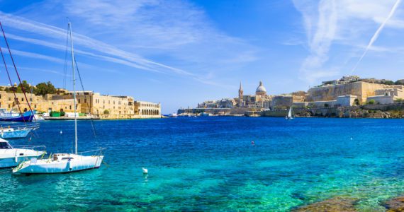 Panoramic,View,Of,Valetta,With,Sailing,Boats,In,Turquoise,Sea.