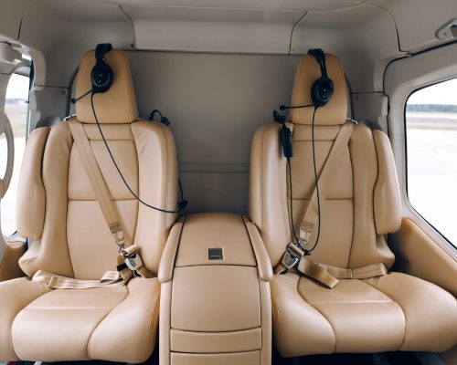 Helicopter passenger leather seats. Interior of luxury helicopter